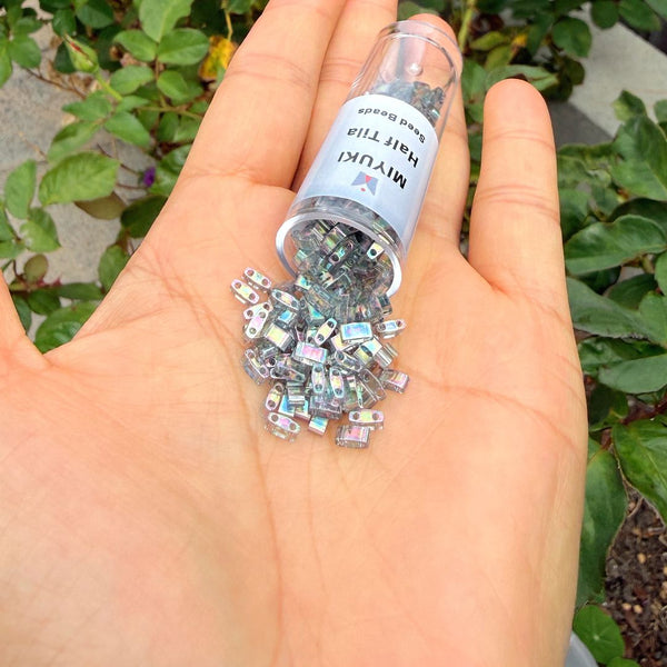 10g Miyuki Half Tila Seed Beads 5x2.3mm, Rainbow Luster Dark Grey (HTL-2440D)