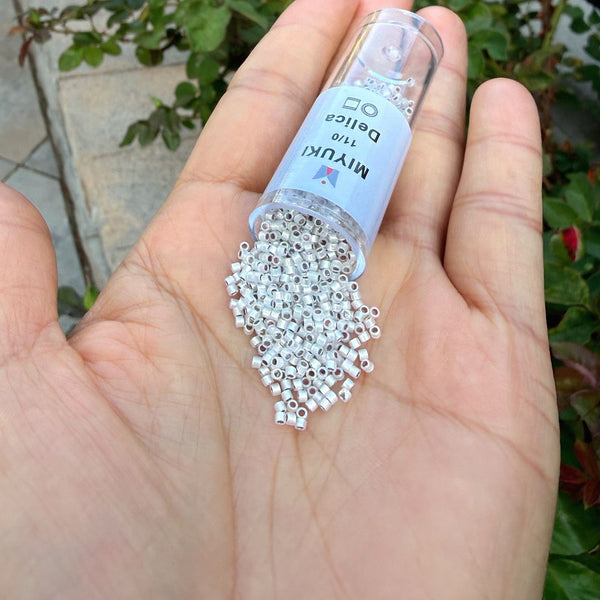 7.5g Miyuki Delica 11/0 Seed Beads, Rainbow Silver-Lined Opal DB223