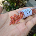 7.5g Miyuki Delica 11/0 Seed Beads, Opaque Rainbow Glazed Persimmon DB2274
