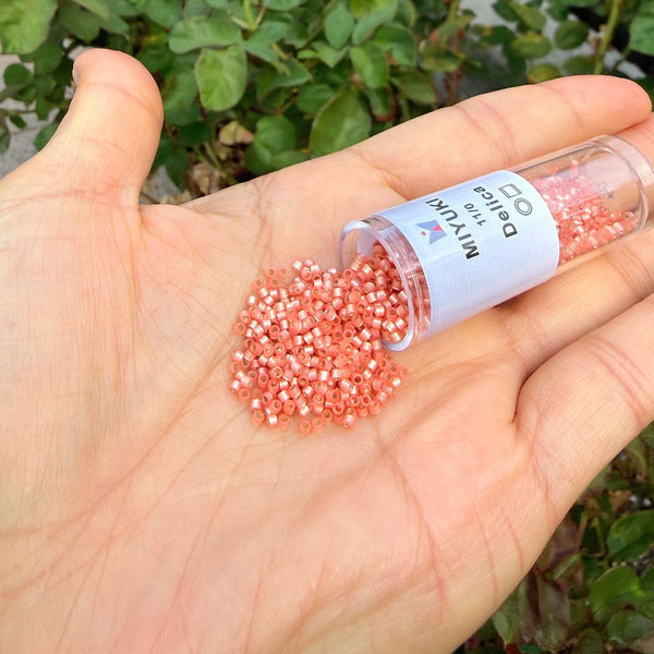 7.5g Miyuki Delica 11/0 Seed Beads, Translucent Silver-Lined Peach DB622