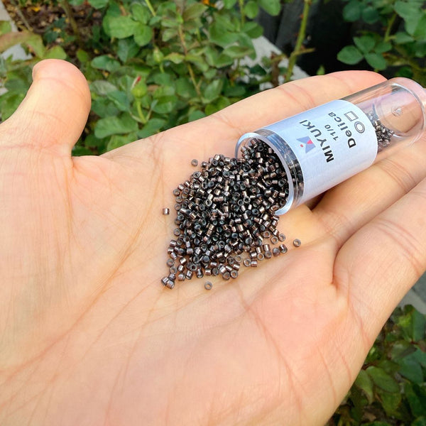7.5g Miyuki Delica 11/0 Seed Beads, Transparent Copper-Lined Grey DB184