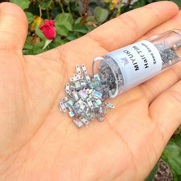 10g Miyuki Half Tila Seed Beads 5x2.3mm, Rainbow Luster Dark Grey (HTL-2440D)