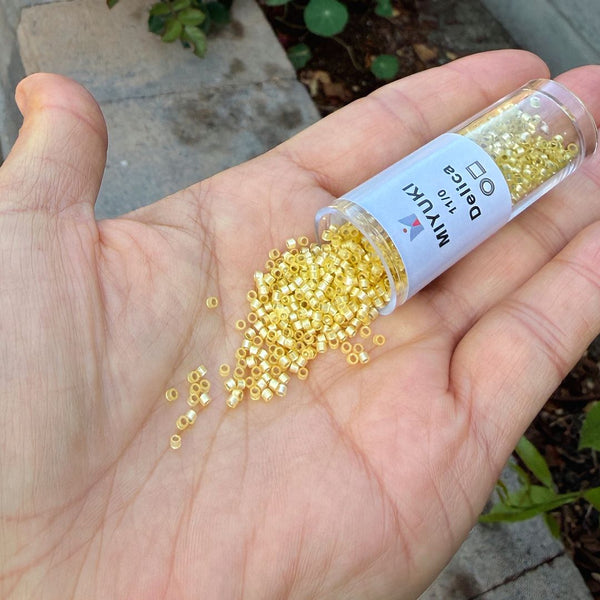 7.5g Miyuki Delica 11/0 Seed Beads, Translucent Silver-Lined Jonquil DB623