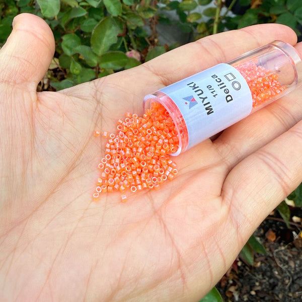 7.5g Miyuki Delica 11/0 Seed Beads, Translucent Luminous Dyed Orange DB2047