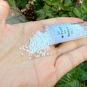 7.5g Miyuki Delica 11/0 Seed Beads, Silk Satin Rainbow Crystal White DB670