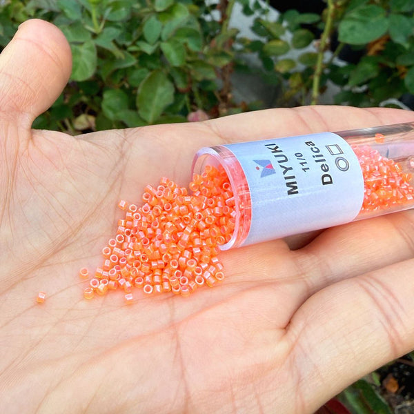 7.5g Miyuki Delica 11/0 Seed Beads, Translucent Luminous Dyed Orange DB2047