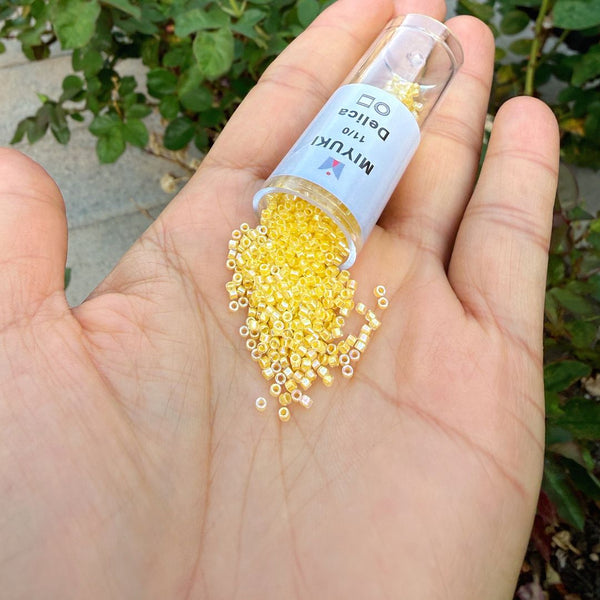 7.5g Miyuki Delica 11/0 Seed Beads, Yellow-Lined Rainbow Crystal Clear DB53