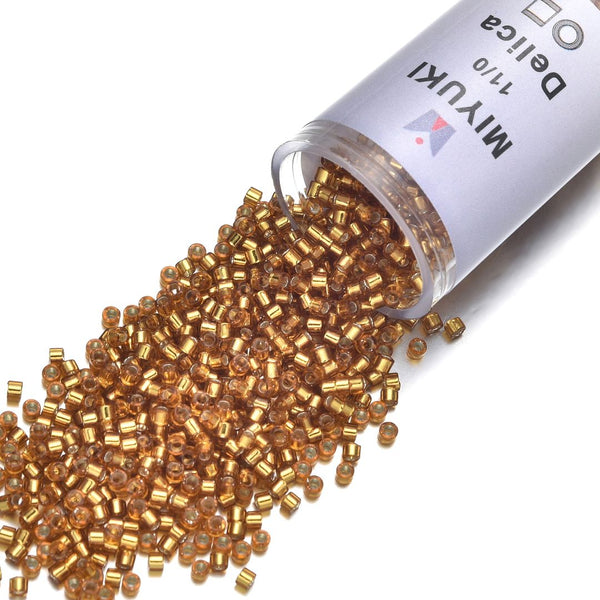 30g Miyuki Delica 11/0 Seed Beads, Transparent Silver-Lined Marigold DB1201