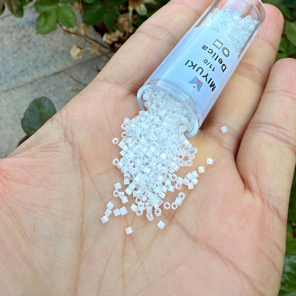7.5g Miyuki Delica 11/0 Seed Beads, Silk Satin Rainbow Crystal White DB670