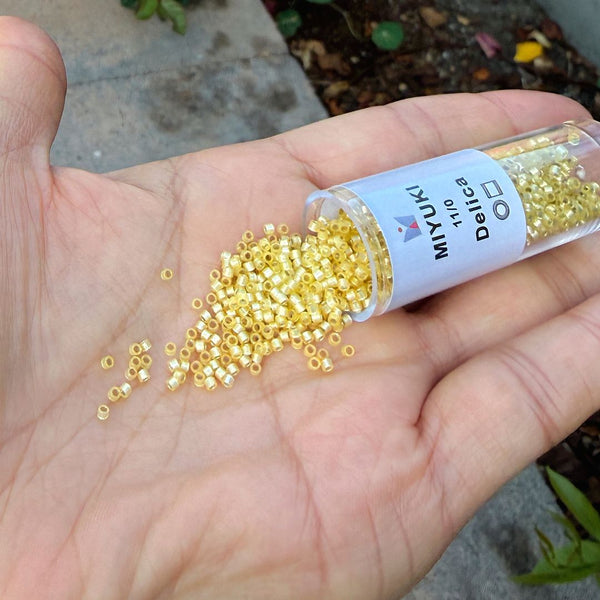 7.5g Miyuki Delica 11/0 Seed Beads, Translucent Silver-Lined Jonquil DB623