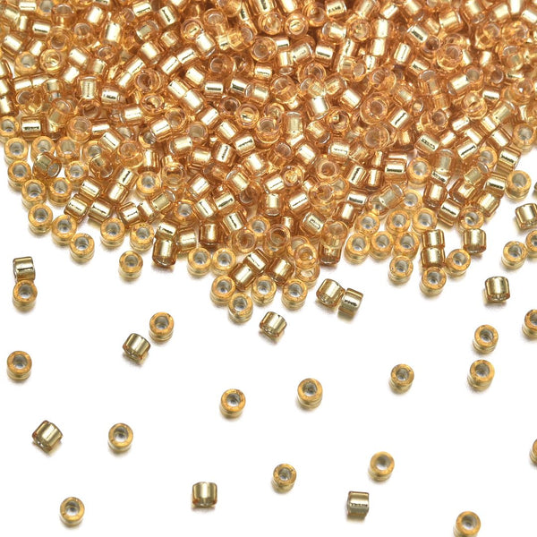 7.5g Miyuki Delica 11/0 Seed Beads, Transparent Silver-Lined Gold DB42